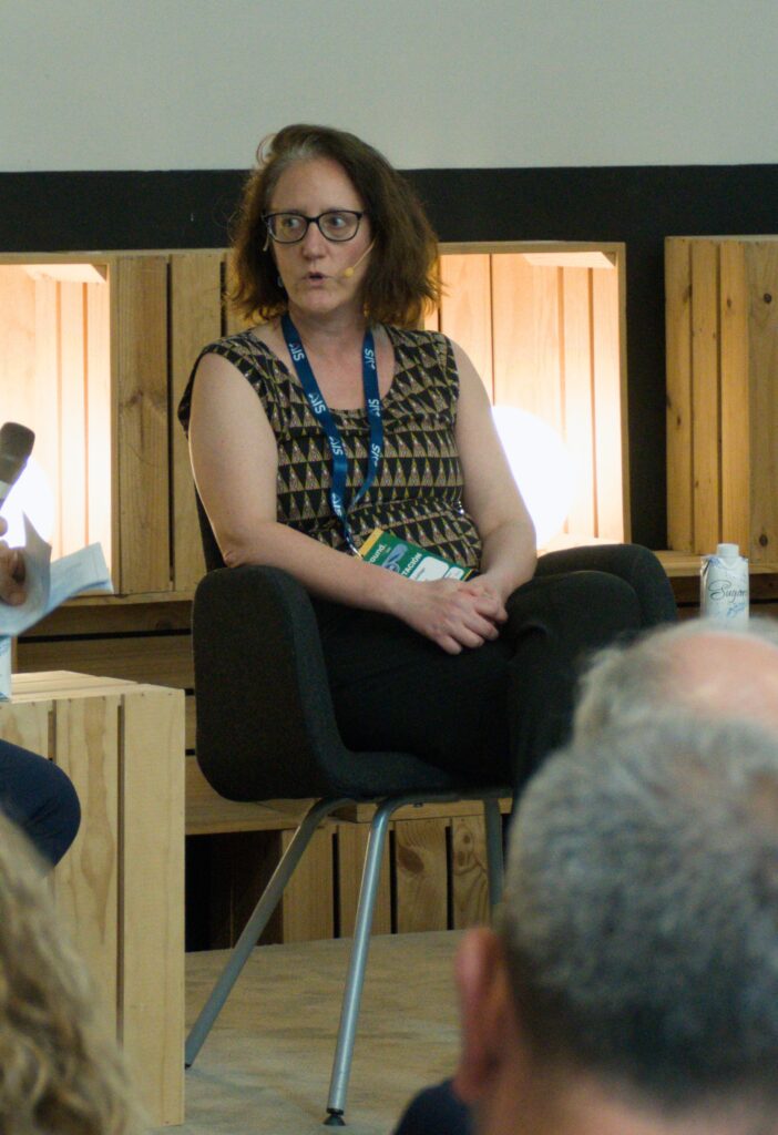 Cristina Gallego, at the table